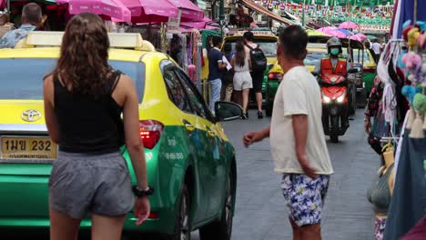 pedestrians navigating through a busy market street