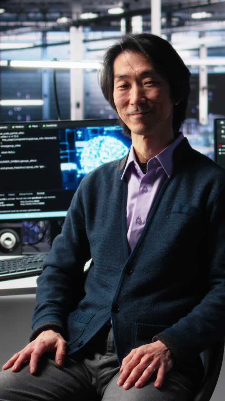 Vertical video Smiling data center manager filming presentation, showcasing AI equipment