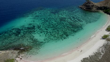 Komodo-aerial-of-the-beach-and-reef-on-a-hot-sunny-day