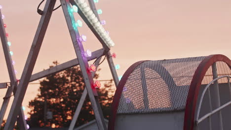 Looper-ride-at-Pennsylvania-carnival-with-spinning-cart-at-dusk,-Slow-Motion