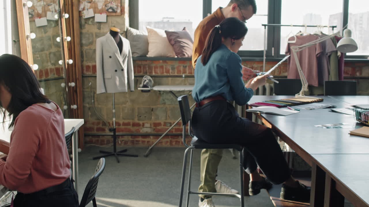 Fashion Designers Working in Studio