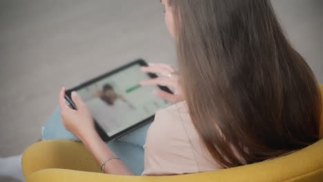 woman using tablet for video call