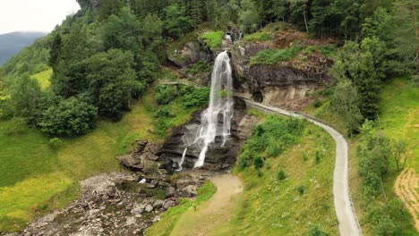 Steinsdalsfossen-is-a-waterfall-in-the-village-of-Steine-in-the-municipality-of-Kvam-in-Hordaland-county,-Norway.-The-waterfall-is-one-of-the-most-visited-tourist-sites-in-Norway.