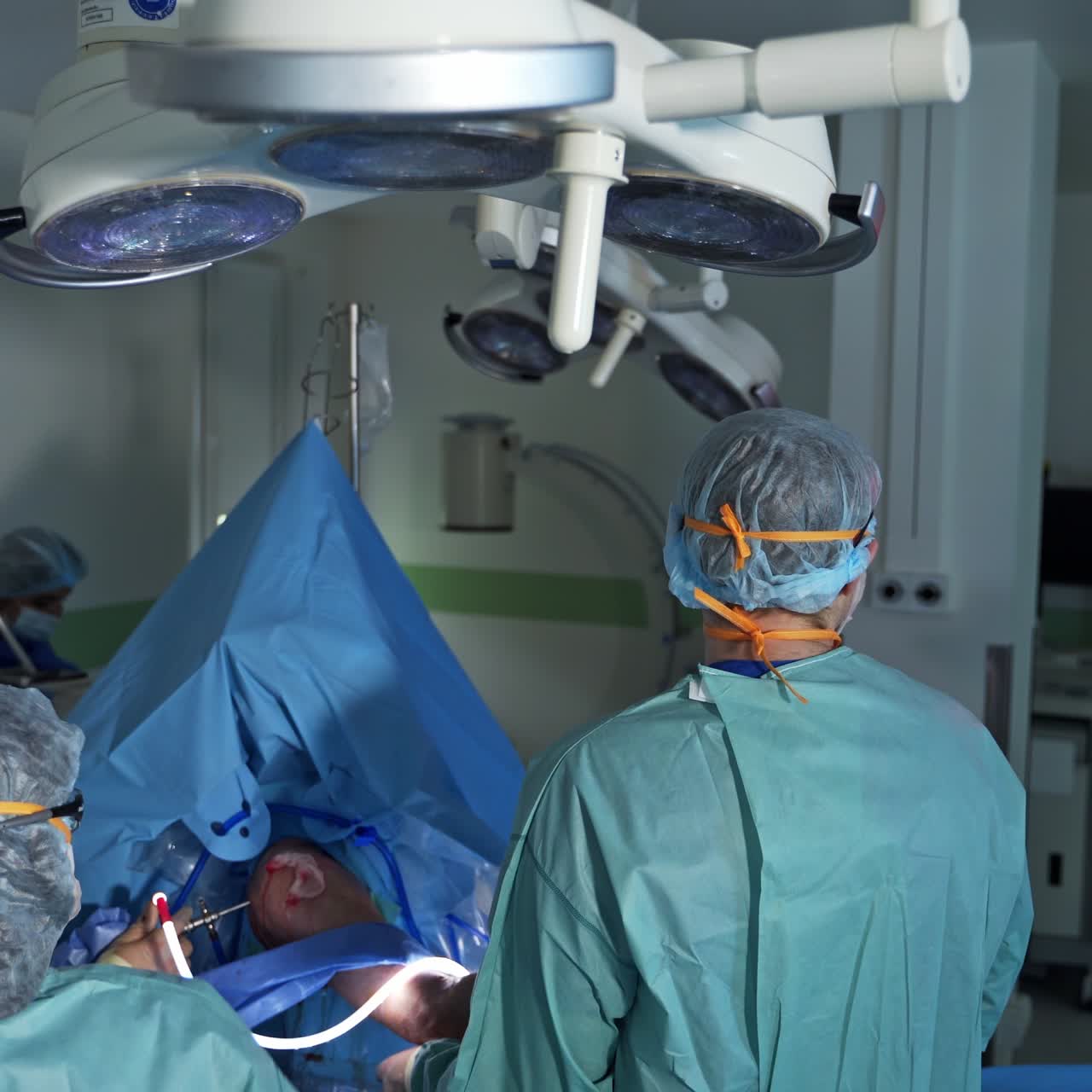 Emergency medical specialists working in team. Surgery doctors in modern hospital ward