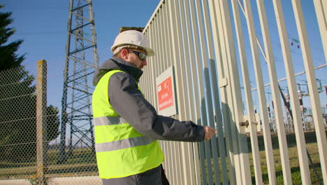 manager wearing personal protective clothing arrives secure power substation