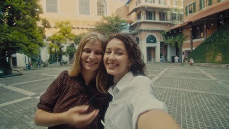 two women taking a selfie in an italian square