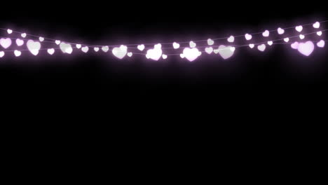 digital animation of purple decorative heart shaped fairy lights hanging against black background