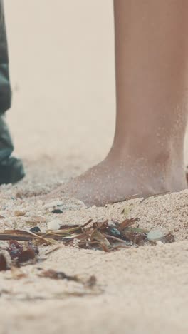 volunteer works tirelessly to clean plastic waste from balis beautiful beaches
