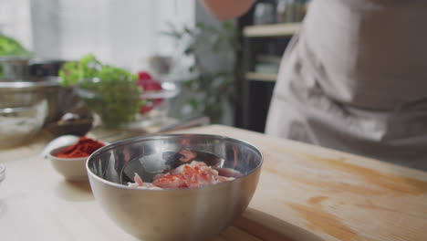 preparing chicken with spices