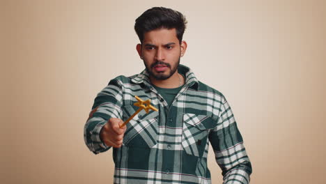 Magician wizard indian man gesturing with magic wand making wish come true casting magician spell