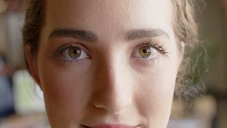 portrait close up of happy caucasian businesswoman smiling at office, slow motion