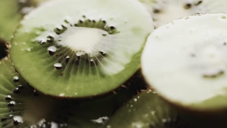 micro video of close up of slices of kiwi fruit with copy space