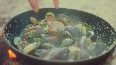 cooking seafood over a campfire