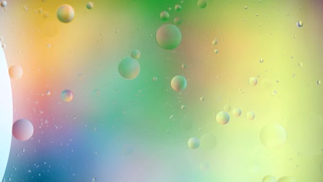 fantastic structure of colorful bubbles. chaotic motion. abstract colorful paint. top view. movement of bubbles in the liquid. oil surface multicolored background. macro