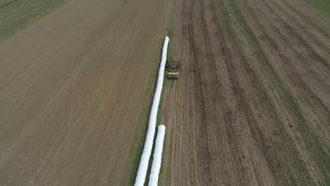 Aerial-View-of-Amish-Farmer-Seeding-His-Field-with-6-Horses