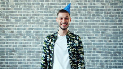 man wearing a party hat