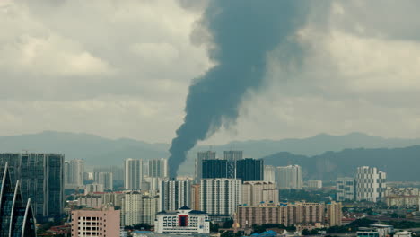 large smoke plume over city
