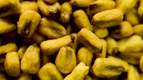 close up rotation of toasted corn kernels spinning in circular rotation