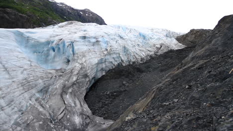 glacier melts in between mountains in alaska