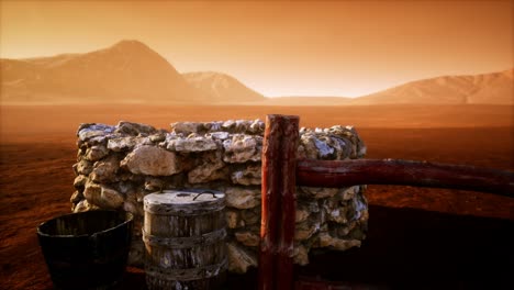 viejo pozo de agua de piedra en el desierto
