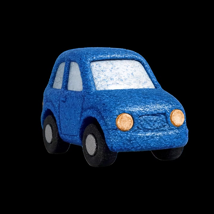 Blue Toy Car Rotating Against Black Background
