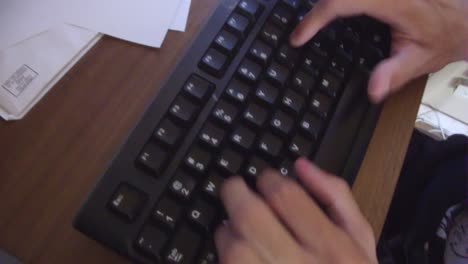 man typing messages on computer