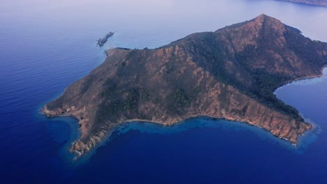 aerial drone view of a scenic rocky island in aegean turkey at morning dawn