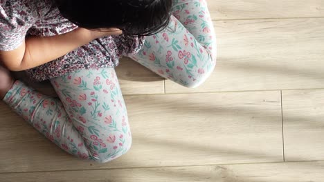 child sitting on the floor