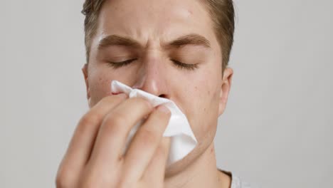 man with a tissue