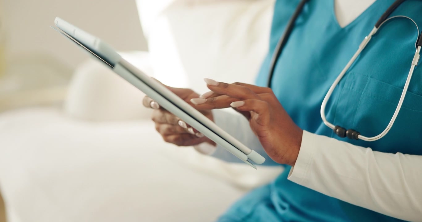 Doctor Using Digital Tablet in Hospital Setting