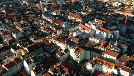 aerial revealing shot of the city of lisbon with the tejo river in the background, protugal