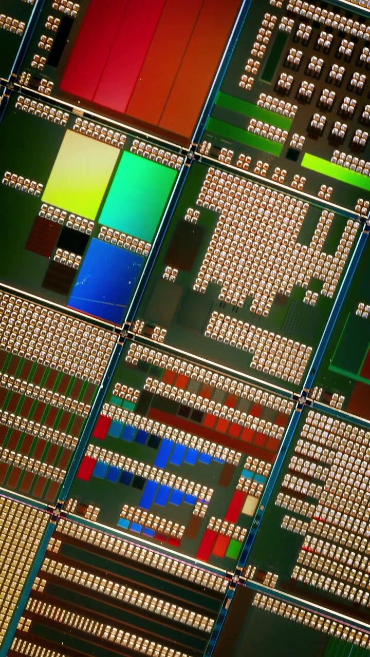 Silicon semiconductor wafer with integrated circuit die mosaic pattern.