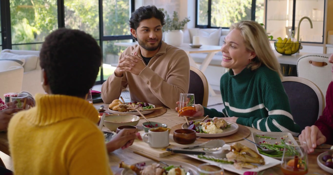 Diverse Friends Enjoying Festive Dinner Together at Home