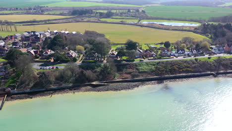 Aerial-flying-away-from-Isle-of-Wight-Sunny-day-UK-4K