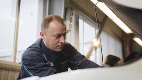 car mechanic working on a car