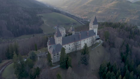 tilting up drone shot of a caslte at sunset in autumn, 4kuhd