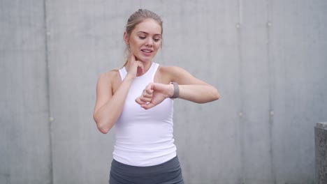 woman checking smartwatch outdoors