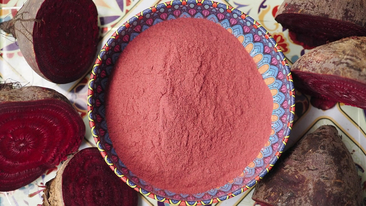 Top View of Vibrant Red Beetroot Powder and Fresh Beets