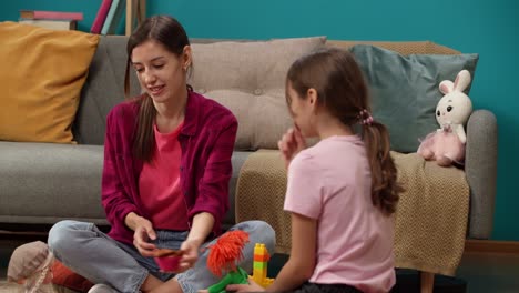 mother and daughter playing with toys