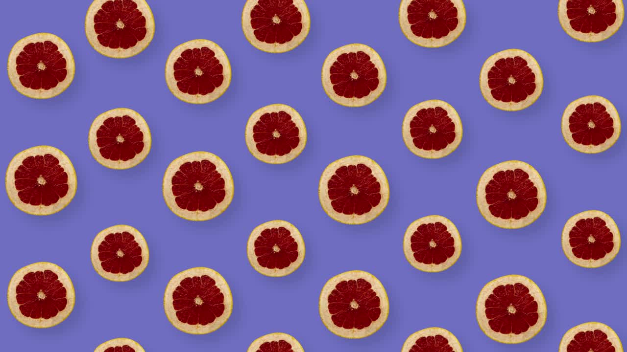 patrón de frutas coloridas de pomelos frescos en fondo púrpura. patrón sin costuras con rebanadas de pomelos. animación realista. movimiento de video 4k