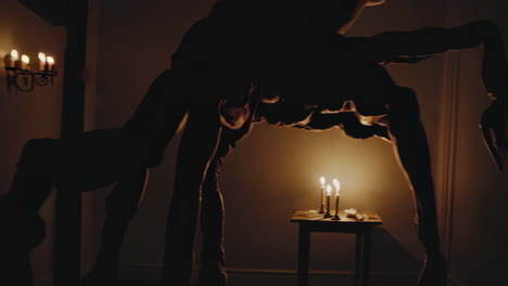 silhouette figures in a dark room