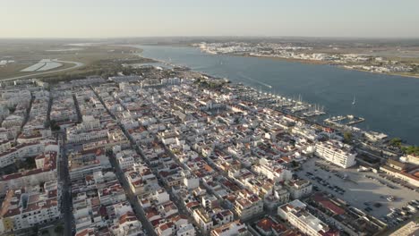 aerial flying over vila real de santo antonio city beside the guadiana river, separating extremadura and andalusia from alentejo and algarve