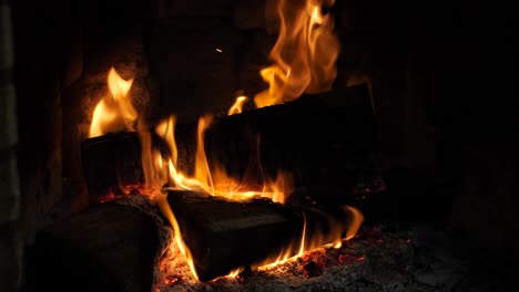 log slow burning cozy warm fireplace, hard wood pile big flames