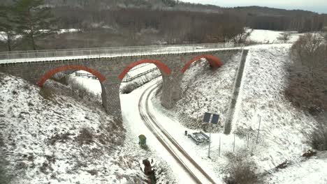 Historic-railway-viaduct-in-a-winter-scenery-seen-from-a-drone