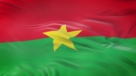 burkina faso flag waving in the wind with highly detailed fabric texture. seamless loop