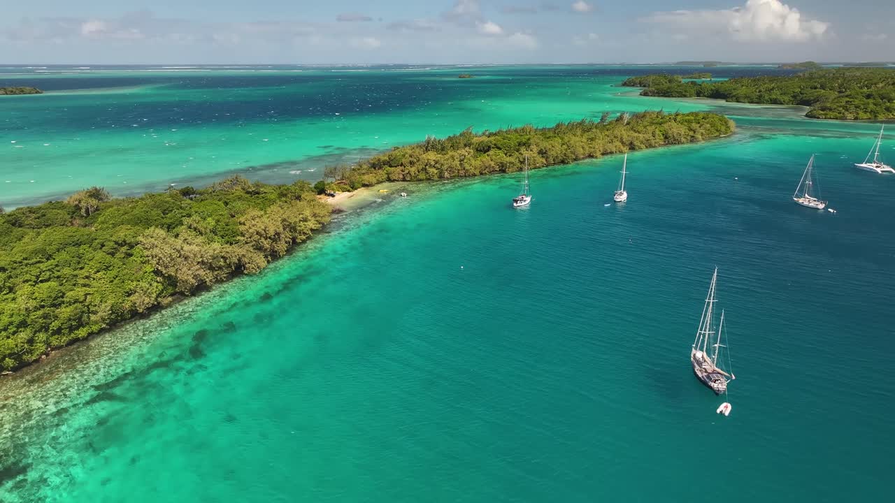 Various Islands Of Vava'u Nestled On Azure Water In Tonga During Daytime. aerial, pull-back shot