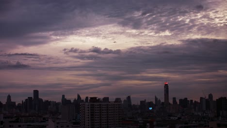 bangkok timelapse with purple skies over the capital city ending in silhouette, thailand