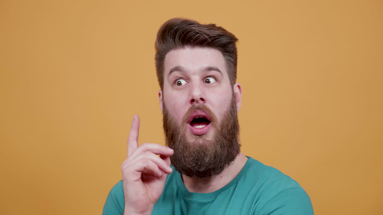 Man with beard thinking and getting an idea
