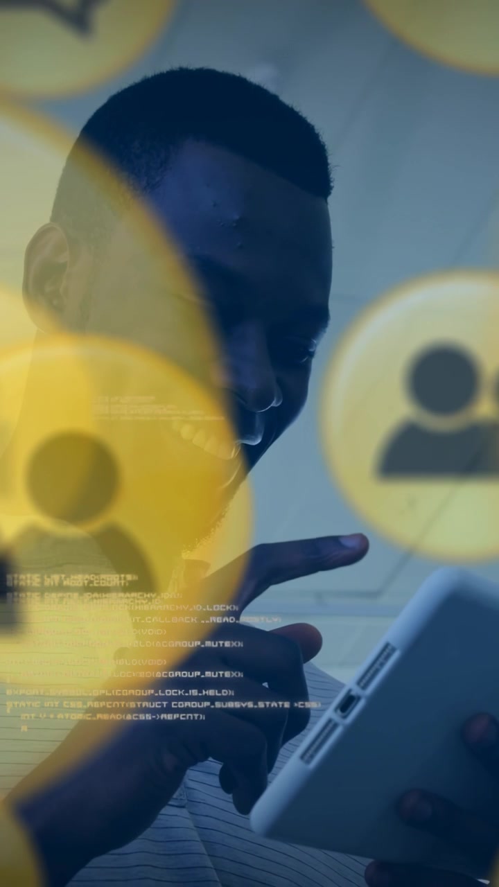 Vertical video: Man tapping tablet, revealing yellow avatars and console text, analyzing tech data