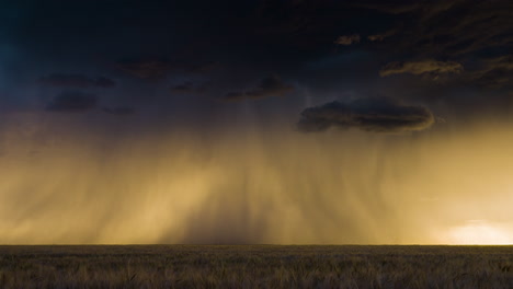lightning strikes flicker below a beautiful storm at sunset